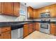 Traditional kitchen featuring wooden cabinets, stainless steel appliances, and dark countertops at 1618 33Rd Ne Ave # 1, Hickory, NC 28601