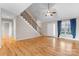 Bright living room with hardwood floors, a staircase, a ceiling fan, and natural light at 1618 33Rd Ne Ave # 1, Hickory, NC 28601