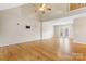 Hardwood floors in a sunlit, open living area with french doors and a TV mount at 1618 33Rd Ne Ave # 1, Hickory, NC 28601