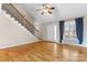 Open-concept living room showcasing hardwood floors, a staircase, natural light, and neutral walls at 1618 33Rd Ne Ave # 1, Hickory, NC 28601
