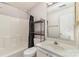 Bathroom featuring a shower and tub, toilet, sink with vanity, mirror, and towel rack at 1720 Forest Side Ln, Charlotte, NC 28213