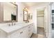 Bathroom features a double sink vanity with two decorative mirrors and tiled floors at 1720 Forest Side Ln, Charlotte, NC 28213