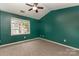 Bedroom with vaulted ceiling, ceiling fan, neutral carpet, and a window providing natural light at 1720 Forest Side Ln, Charlotte, NC 28213