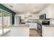 Bright kitchen features an island, granite countertops, and stainless steel appliances at 1720 Forest Side Ln, Charlotte, NC 28213