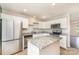 Well-lit kitchen featuring granite countertops, stainless steel appliances, and a central island at 1720 Forest Side Ln, Charlotte, NC 28213