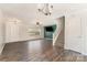 Open-concept living area with modern lighting, staircase, and neutral decor at 1720 Forest Side Ln, Charlotte, NC 28213