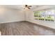 Spacious living room features wood-look flooring and a large window for natural light at 1720 Forest Side Ln, Charlotte, NC 28213