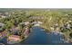 An aerial view of the complex featuring condos on the lake with a beach and boat docks at 17810 Half Moon Ln # L, Cornelius, NC 28031