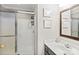 A full bathroom with a large vanity and a separate enclosed shower with glass doors at 17810 Half Moon Ln # L, Cornelius, NC 28031