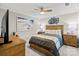 A beautifully staged bedroom featuring a wooden bed, nightstands, and decorative beach-themed art at 17810 Half Moon Ln # L, Cornelius, NC 28031