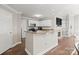 Eat-in kitchen with granite counters, tile backsplash, and stainless steel appliances at 17810 Half Moon Ln # L, Cornelius, NC 28031