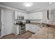 Modern kitchen with updated stainless steel appliances and beautiful granite countertops at 17810 Half Moon Ln # L, Cornelius, NC 28031