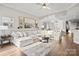 Bright and open living room with a large sectional sofa, modern decor, and hardwood floors at 17810 Half Moon Ln # L, Cornelius, NC 28031