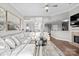 Bright living room with a plush sectional sofa, a modern ceiling fan, and a cozy atmosphere at 17810 Half Moon Ln # L, Cornelius, NC 28031
