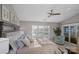 This main bedroom has a waterfront view from the large sliding glass door with access to a private balcony at 17810 Half Moon Ln # L, Cornelius, NC 28031