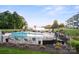 Community swimming pool and lake access with lounge seating and manicured landscaping at 17810 Half Moon Ln # L, Cornelius, NC 28031