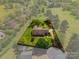 Overhead shot of a well-kept home, featuring lush greenery, mature trees, and a spacious yard at 189 Billy Jo Rd, Mooresville, NC 28117