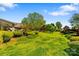 Expansive backyard with lush green lawn, mature trees, and well-maintained landscaping at 189 Billy Jo Rd, Mooresville, NC 28117