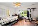 Bedroom featuring a bed, punching bag, chair, and window with backyard views at 189 Billy Jo Rd, Mooresville, NC 28117