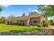 Well-maintained brick home with a lush green lawn and beautiful landscaping at 189 Billy Jo Rd, Mooresville, NC 28117
