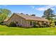 Well-manicured lawn surrounds this brick home with beautiful landscaping at 189 Billy Jo Rd, Mooresville, NC 28117