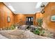 Grand foyer with pond feature, stone flooring, skylights, and wood-paneled walls at 189 Billy Jo Rd, Mooresville, NC 28117