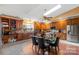 A bright kitchen and dining area feature wood cabinets, stainless appliances, and great natural light at 189 Billy Jo Rd, Mooresville, NC 28117