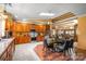 Spacious kitchen and dining area with wood cabinets, modern appliances, and beautiful natural lighting at 189 Billy Jo Rd, Mooresville, NC 28117
