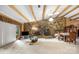 Living room showcasing a stone fireplace, wood beam ceilings, and an open layout for entertaining at 189 Billy Jo Rd, Mooresville, NC 28117