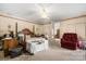 A comfortable main bedroom with neutral tones, a ceiling fan, and an adjoining living space at 189 Billy Jo Rd, Mooresville, NC 28117