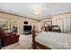 The main bedroom features neutral paint, a ceiling fan, and a screened-in porch access at 189 Billy Jo Rd, Mooresville, NC 28117