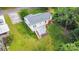 Aerial shot showcasing the property's backyard, deck and proximity to mature trees at 204 Myers St, Fort Mill, SC 29715