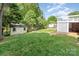 Grassy backyard showing the home's deck and a backyard shed for storage at 204 Myers St, Fort Mill, SC 29715