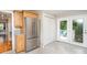 Kitchen with stainless steel refrigerator and access to outdoor deck at 204 Myers St, Fort Mill, SC 29715