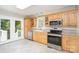 Well-lit kitchen with granite countertops and stainless steel appliances at 204 Myers St, Fort Mill, SC 29715