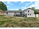 Large backyard view shows the house with a two-story deck and lots of green space at 205 Mcgregor Rd, Gastonia, NC 28056