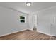 Bright bathroom with modern fixtures and wood-look flooring at 205 Mcgregor Rd, Gastonia, NC 28056