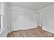 Bedroom features luxury vinyl flooring, and a closet, and access to a different room in the house at 205 Mcgregor Rd, Gastonia, NC 28056