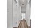 Bright hallway with luxury vinyl flooring and white trim leads to other rooms in the home at 205 Mcgregor Rd, Gastonia, NC 28056