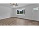 Bright living room featuring new floors, a large front window, and neutral paint at 205 Mcgregor Rd, Gastonia, NC 28056
