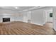 Open living room featuring a fireplace, wood flooring, and ample space at 205 Mcgregor Rd, Gastonia, NC 28056