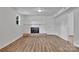 Spacious living room featuring a classic fireplace and wood floors at 205 Mcgregor Rd, Gastonia, NC 28056