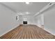 Large living room with wood floors and a traditional fireplace at 205 Mcgregor Rd, Gastonia, NC 28056