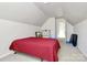 Attic bedroom with red bed, neutral walls and carpet, and a window for natural light at 2110 Cool Springs Ct, Kannapolis, NC 28083
