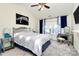 Cozy bedroom with mirrored furniture, a ceiling fan, and plenty of natural light for a peaceful retreat at 2110 Cool Springs Ct, Kannapolis, NC 28083