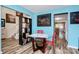 Cozy dining area with bright blue walls, stylish décor, and a clear view into other parts of the home at 2110 Cool Springs Ct, Kannapolis, NC 28083