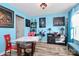Bright dining room featuring a glass table, eye-catching blue walls, and tasteful decorative accents at 2110 Cool Springs Ct, Kannapolis, NC 28083