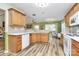 Charming kitchen with wood cabinetry, stainless appliances, and a view of the bright sunroom at 2110 Cool Springs Ct, Kannapolis, NC 28083