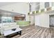 Bright living room features an open floor plan, modern flooring, and seamlessly connects to the kitchen area at 2110 Cool Springs Ct, Kannapolis, NC 28083