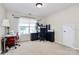 Bright home office with large window, neutral carpet, and black desk set with lots of storage at 2110 Cool Springs Ct, Kannapolis, NC 28083